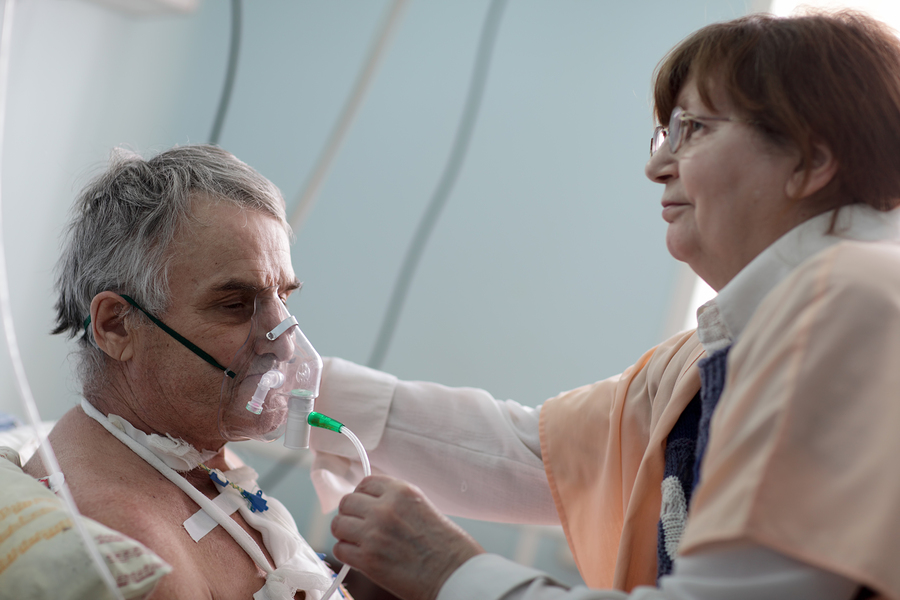 Doctor Setting Oxygen Mask