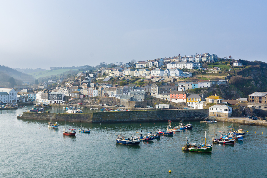 Mevagissey Cornwall - April 12 2018: Mevagissey harbour within the Cornwall Area of Outstanding Natural Beauty the village dates to the medieval period and is a popular destination for tourists