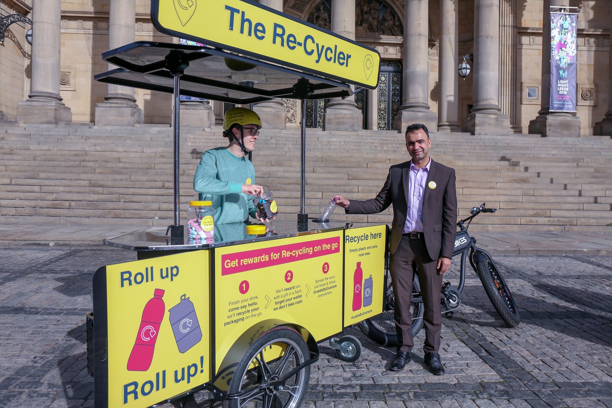 A picture of Councillor Mohammed Rafique recycling in Leeds city centre.