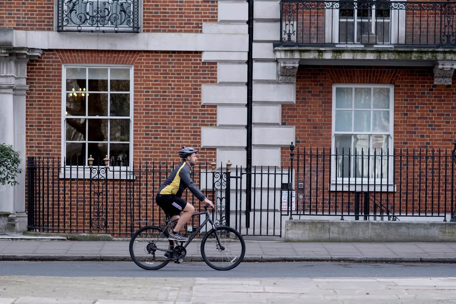 A picture of a cyclist travelling through the city.