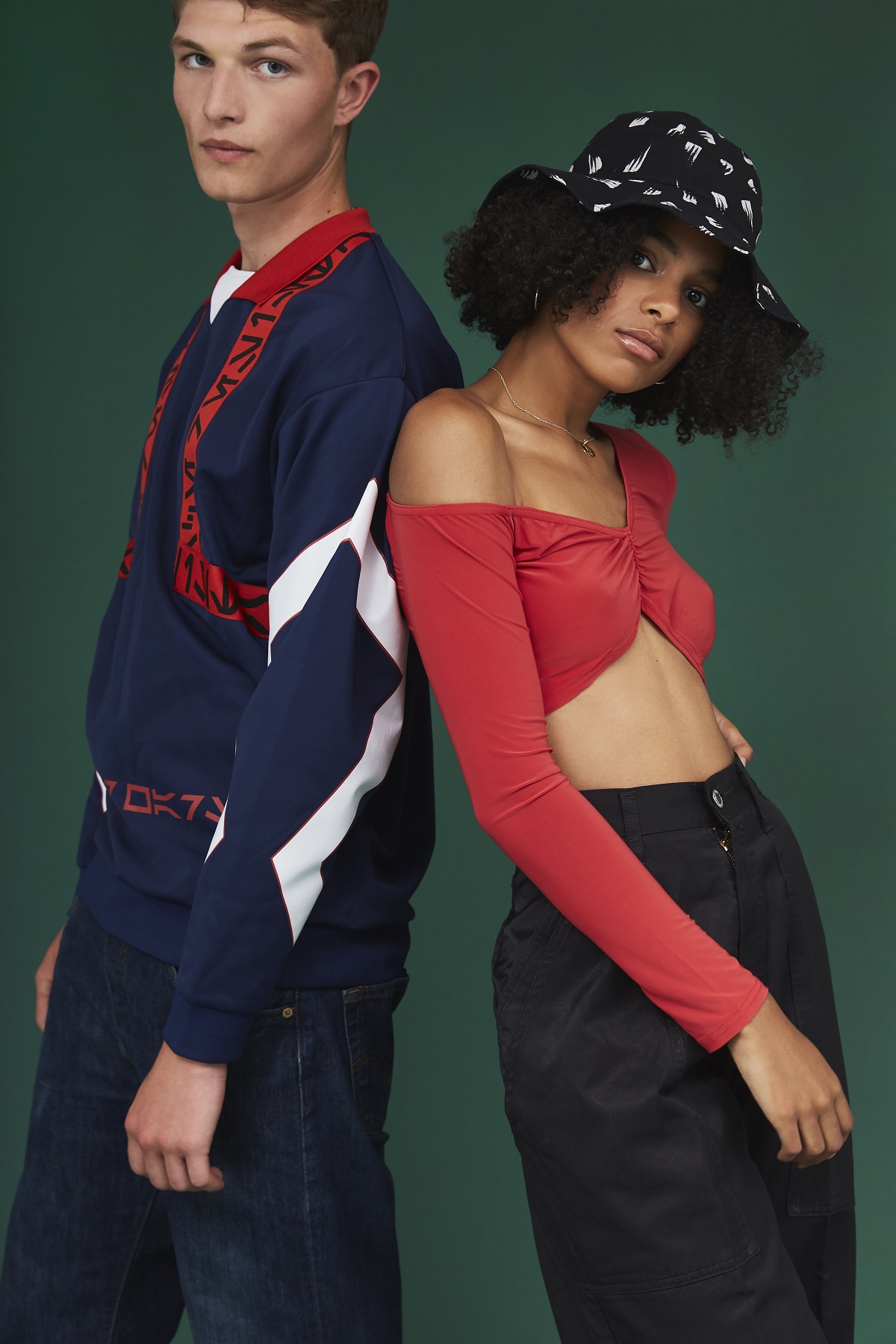 Two models showing off their second-hand outfits.