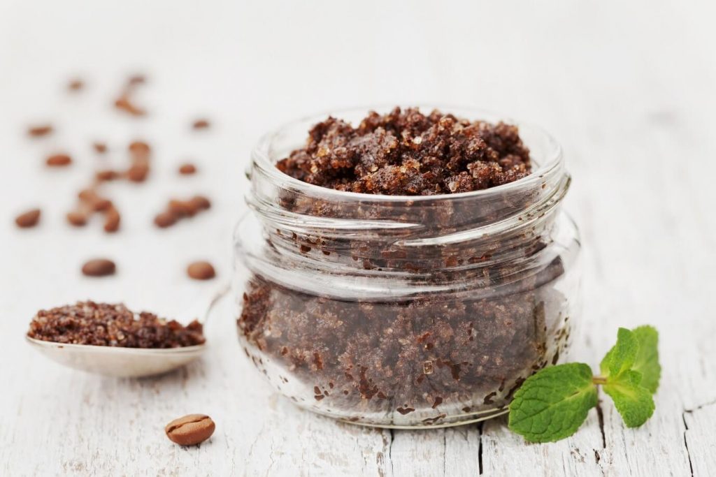 Homemade coffee body scrub in glass jar