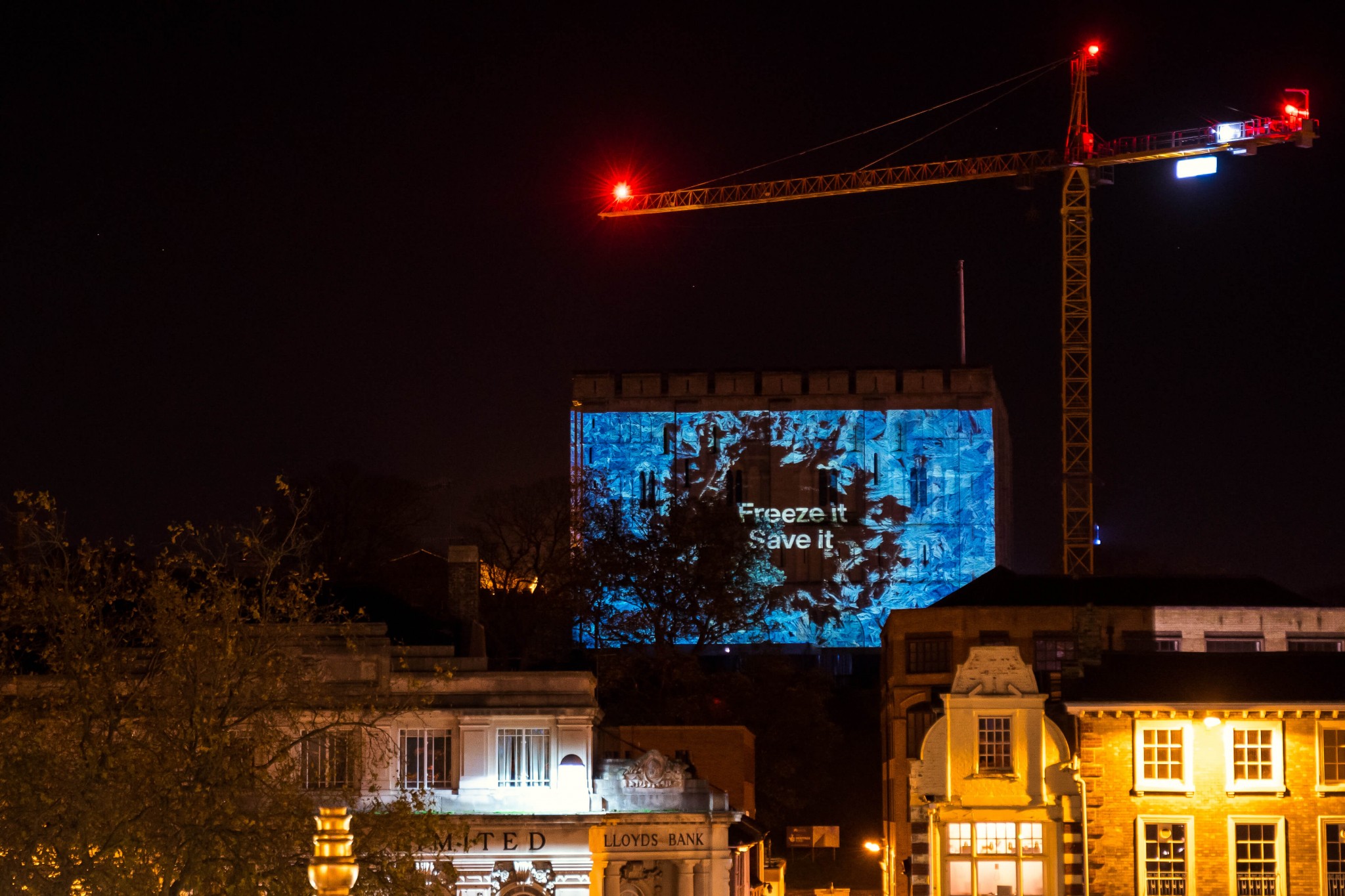 Norwich Castle glows white to highlight 6.7 million pints of milk poured down drains.