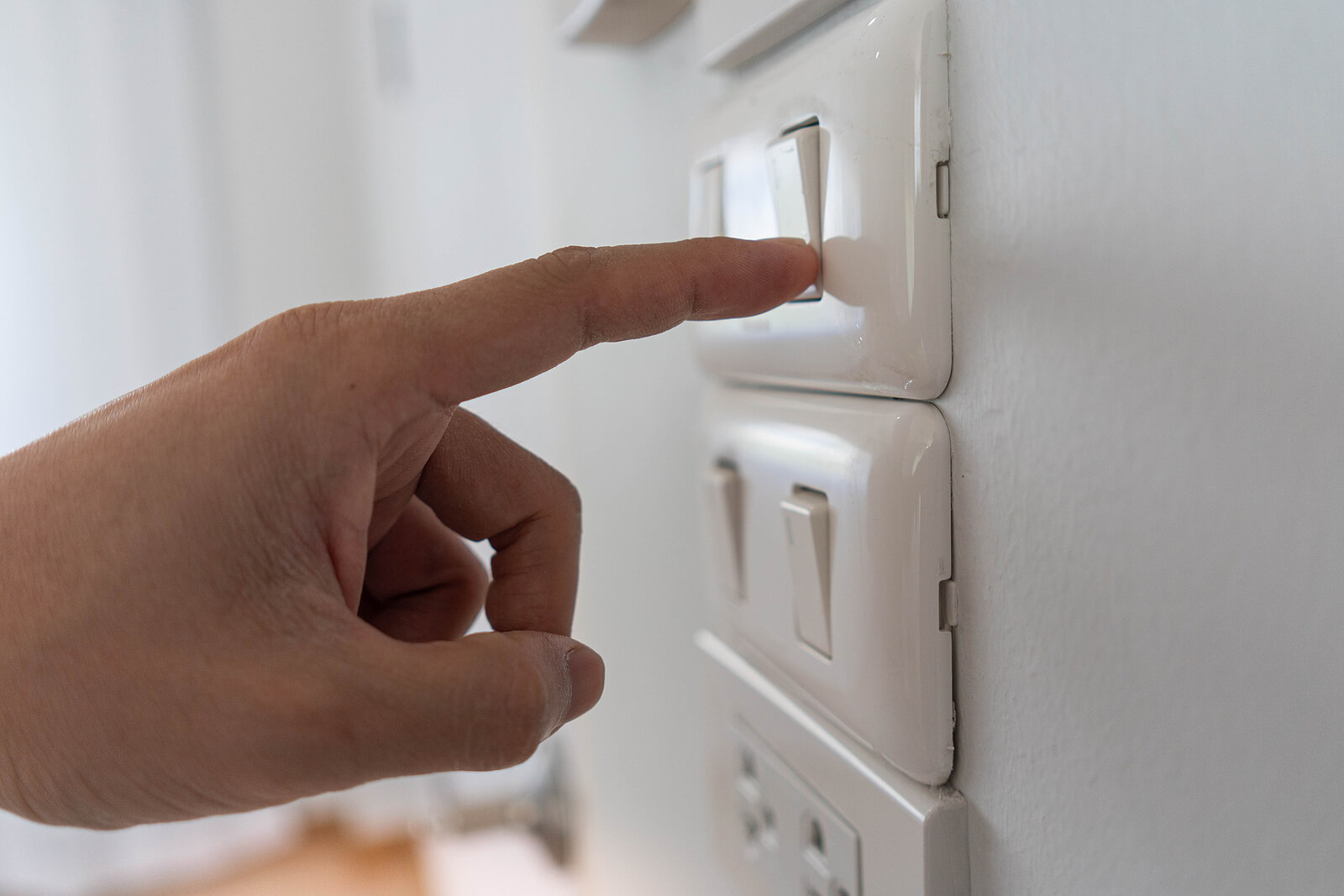 Turning Off The Lights To Save Electricity.