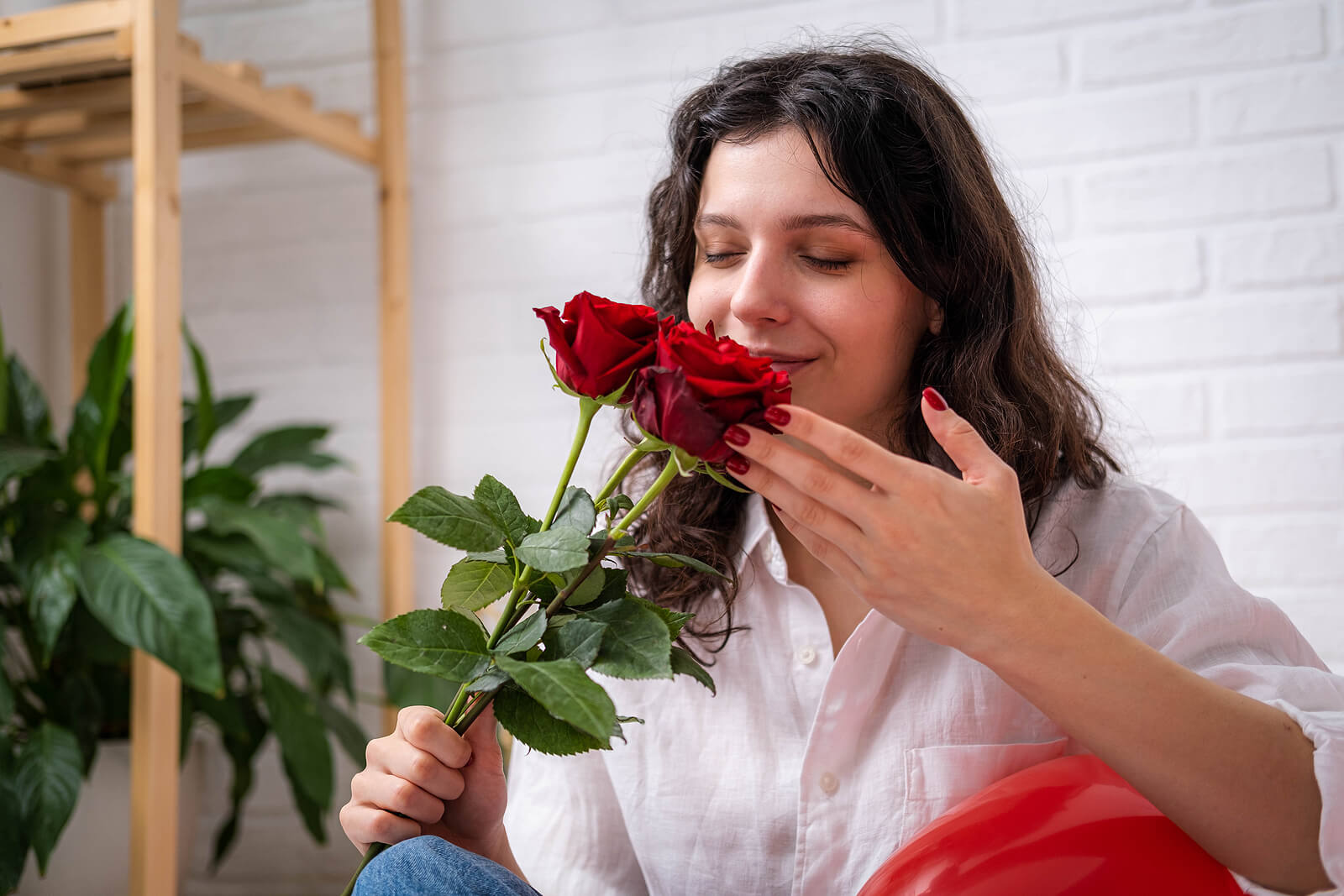 Girl Smelling Bouquet Of Roses