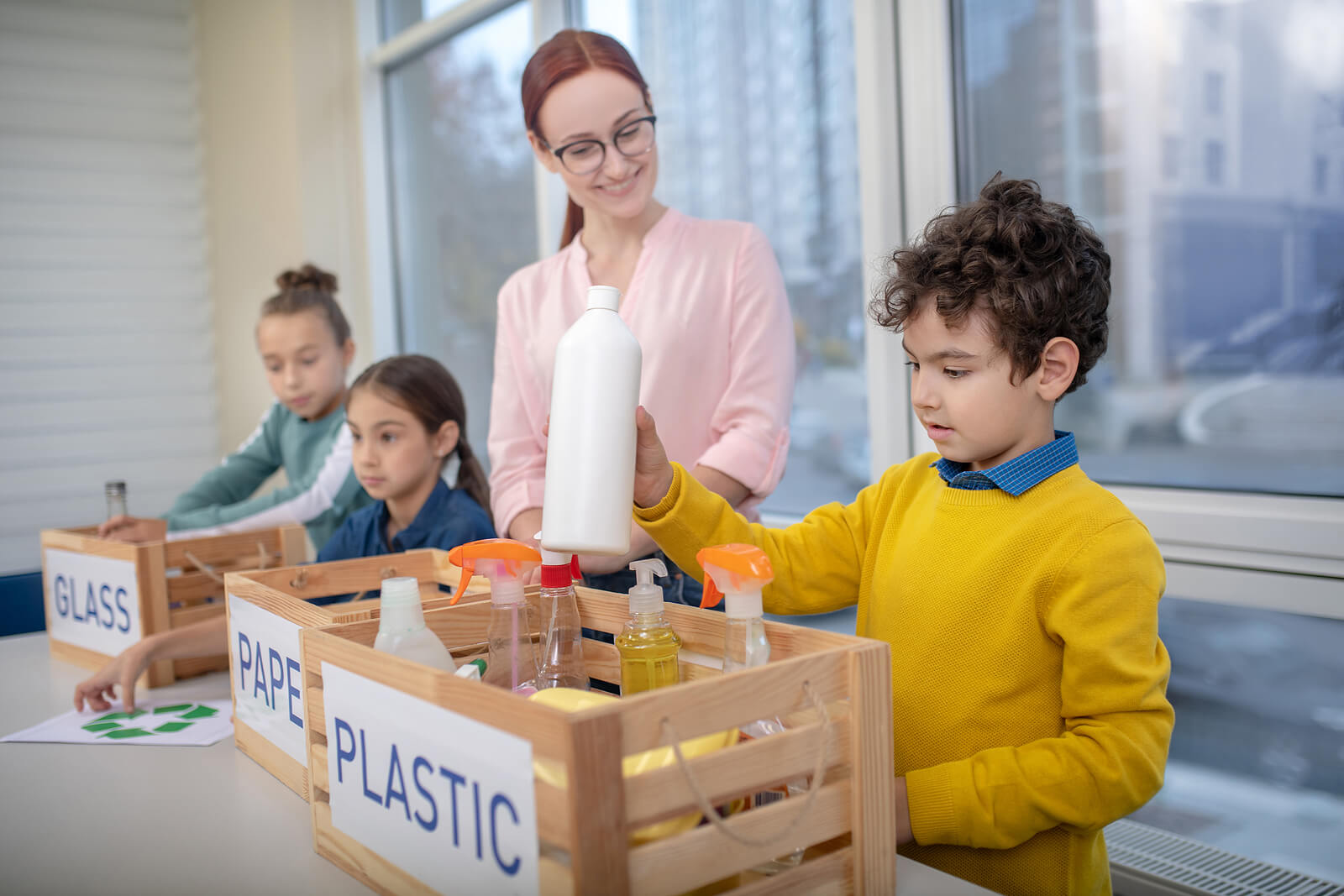 School Children Learning How To Recycle & Sort Waste