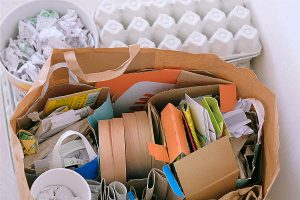 Paper and cardboard prepared for recycling. Bundles of cardboard to be recycled.